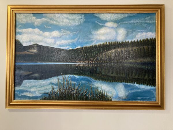 A painting of a lake with trees in the background.